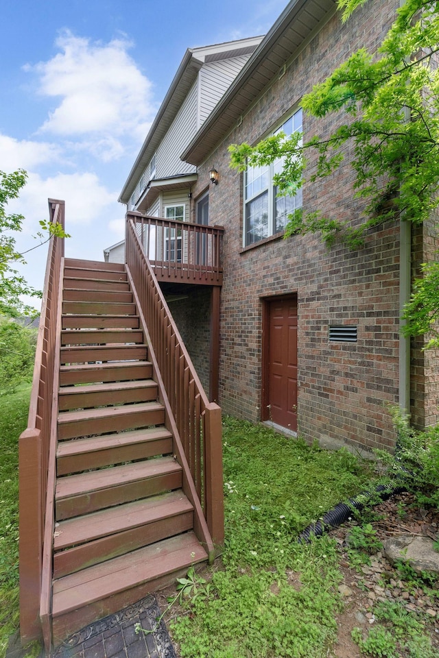 5512 Oak Chase Dr, Antioch, TN 37013 - rear view of house with a wooden deck, stairway, and brick siding
