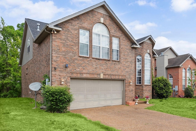 5512 Oak Chase Dr, Antioch, TN 37013 - view of front of house with brick siding, driveway, a front yard, and a garage