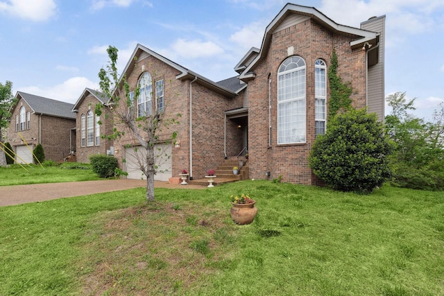5512 Oak Chase Dr, Antioch, TN 37013 - traditional-style home featuring driveway, a chimney, a front yard, a garage, and brick siding
