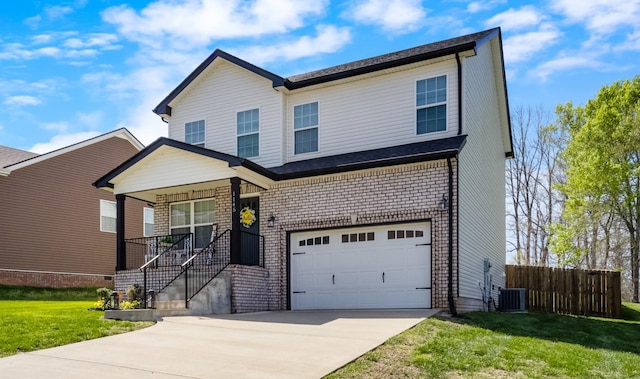 1145 Racker Dr, Clarksville, TN 37043 - view of front of property featuring fence, an attached garage, a front lawn, central AC unit, and concrete driveway
