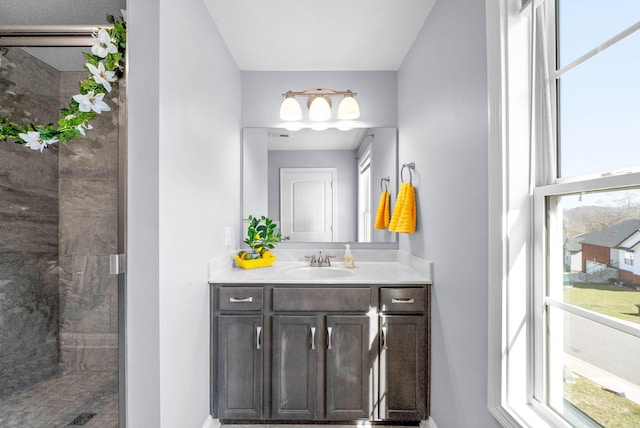 1145 Racker Dr, Clarksville, TN 37043 - full bath featuring vanity, baseboards, a healthy amount of sunlight, and a tile shower