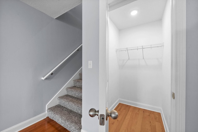 1145 Racker Dr, Clarksville, TN 37043 - staircase with baseboards and wood finished floors