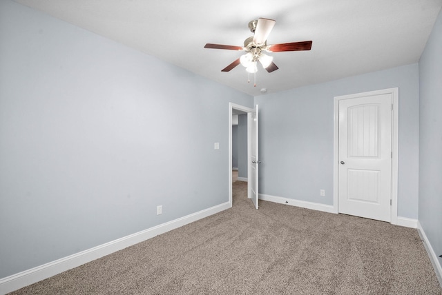 1145 Racker Dr, Clarksville, TN 37043 - unfurnished bedroom featuring carpet floors, a ceiling fan, and baseboards