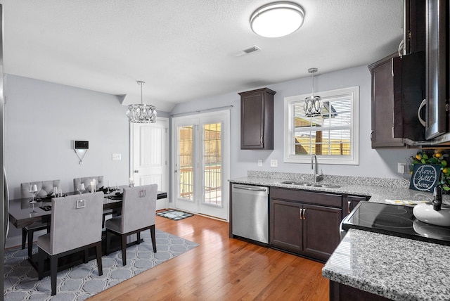 1145 Racker Dr, Clarksville, TN 37043 - kitchen with visible vents, dark brown cabinets, a sink, dishwasher, and a chandelier