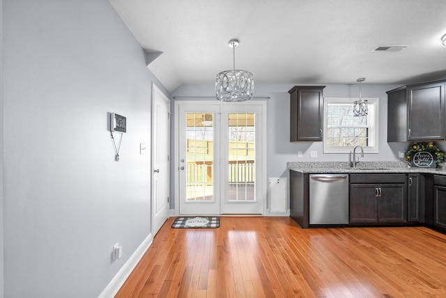 1145 Racker Dr, Clarksville, TN 37043 - interior space featuring an inviting chandelier, a sink, visible vents, and light wood-type flooring