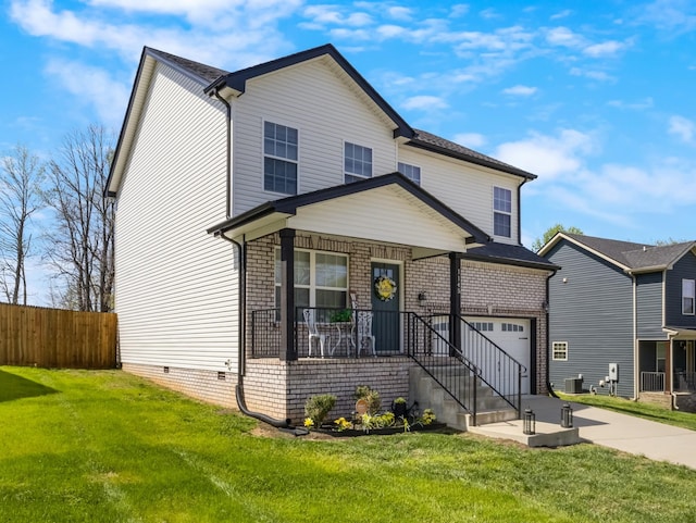 1145 Racker Dr, Clarksville, TN 37043 - traditional-style house with a garage, a front lawn, fence, and concrete driveway