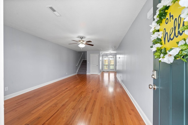 1145 Racker Dr, Clarksville, TN 37043 - interior space featuring visible vents, baseboards, ceiling fan, stairway, and light wood finished floors