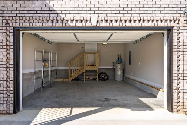 1145 Racker Dr, Clarksville, TN 37043 - garage with water heater, a garage door opener, and electric panel