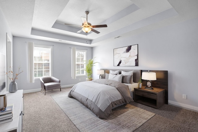 1145 Racker Dr, Clarksville, TN 37043 - bedroom featuring baseboards, light carpet, a tray ceiling, and visible vents