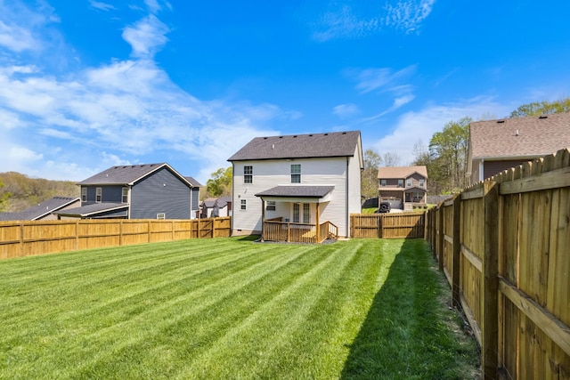 1145 Racker Dr, Clarksville, TN 37043 - back of house with a fenced backyard, a yard, a deck, and a residential view