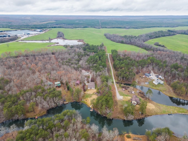 birds eye view of property featuring a water view and a rural view