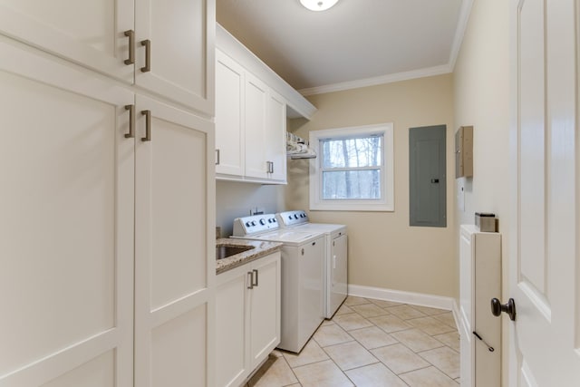 laundry area featuring crown molding, baseboards, washer and clothes dryer, electric panel, and cabinet space