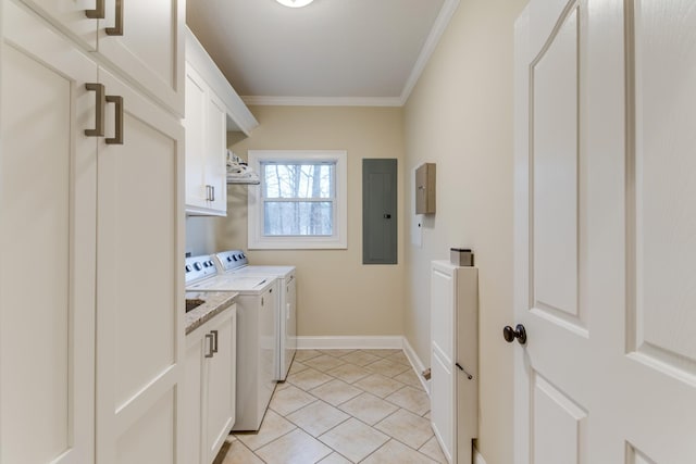 washroom featuring electric panel, crown molding, cabinet space, baseboards, and washer and dryer