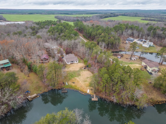 aerial view featuring a water view and a wooded view