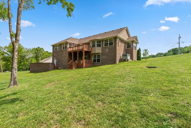 629 Natalie Ln, Spring Hill, TN 37174 - rear view of house with brick siding, a lawn, a wooden deck, and stairs