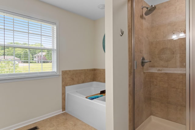 629 Natalie Ln, Spring Hill, TN 37174 - bathroom featuring baseboards, tile patterned flooring, a bath, and a stall shower