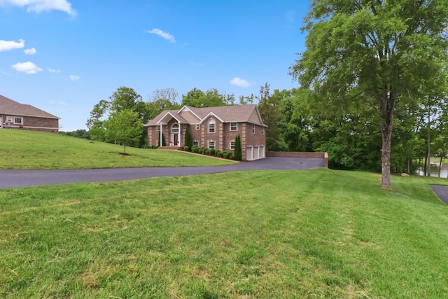 629 Natalie Ln, Spring Hill, TN 37174 - view of front of home featuring a garage, a front lawn, and driveway