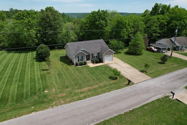215 Desperado Ave, Pulaski, TN 38478 - drone / aerial view with a wooded view