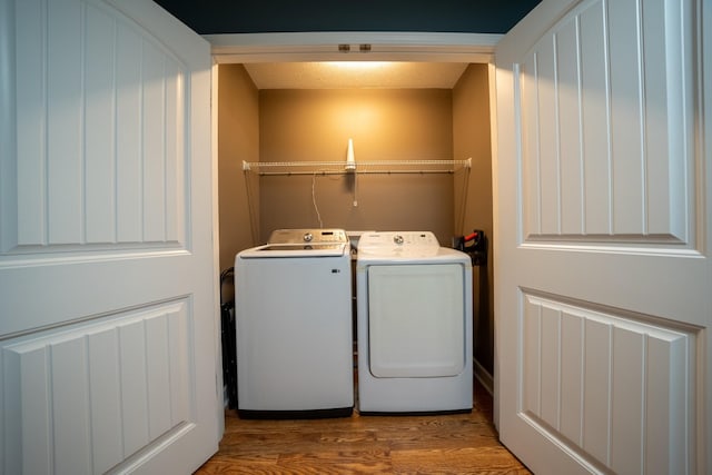 215 Desperado Ave, Pulaski, TN 38478 - clothes washing area featuring laundry area, wood finished floors, and washer and clothes dryer