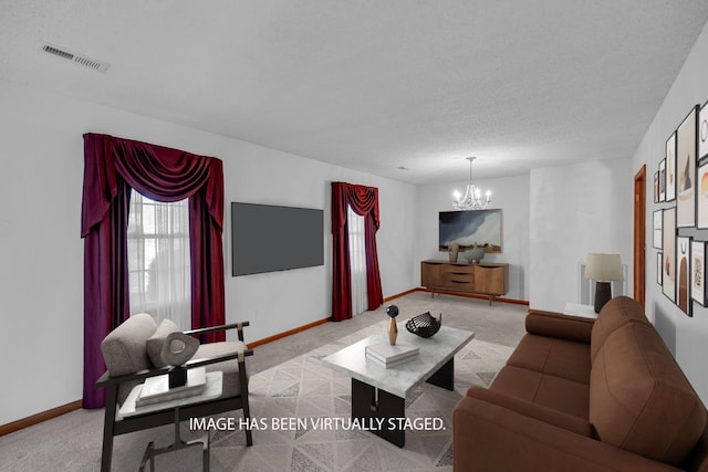 carpeted living room featuring an inviting chandelier, baseboards, and visible vents