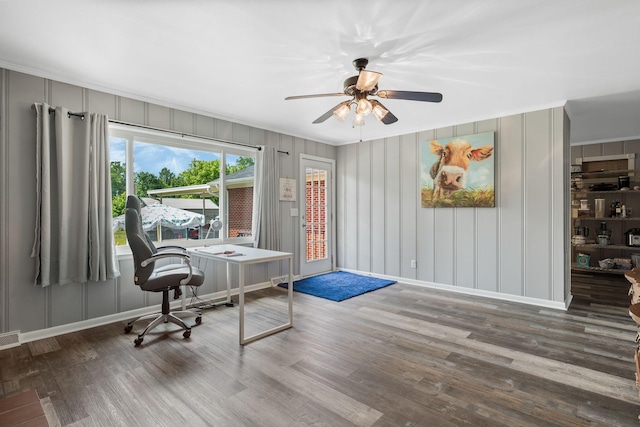 office area with crown molding, a ceiling fan, baseboards, and wood finished floors