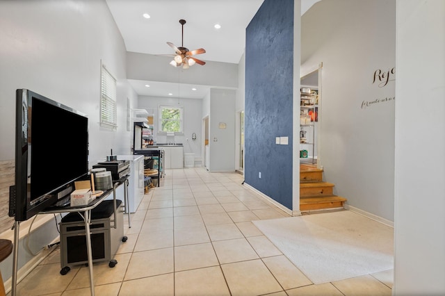 entryway featuring stairs, a ceiling fan, baseboards, recessed lighting, and light tile patterned floors