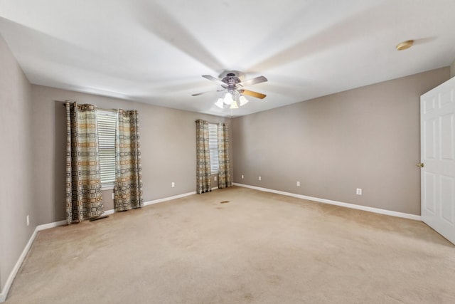447 Canaan Rd, Columbia, TN 38401 - spare room with ceiling fan, visible vents, light carpet, and baseboards
