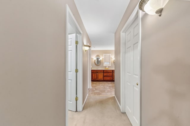 447 Canaan Rd, Columbia, TN 38401 - hallway featuring baseboards and light carpet