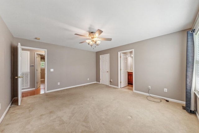 447 Canaan Rd, Columbia, TN 38401 - unfurnished bedroom with baseboards, light carpet, and ceiling fan
