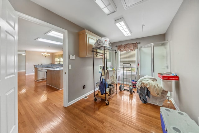447 Canaan Rd, Columbia, TN 38401 - interior space with baseboards, a chandelier, attic access, and light wood-type flooring