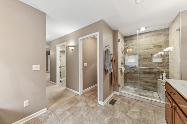 447 Canaan Rd, Columbia, TN 38401 - full bathroom with baseboards, visible vents, a shower stall, and vanity