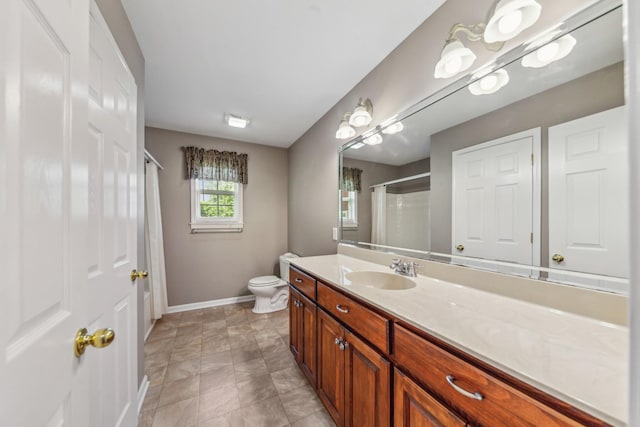 447 Canaan Rd, Columbia, TN 38401 - full bathroom featuring vanity, toilet, baseboards, and a shower