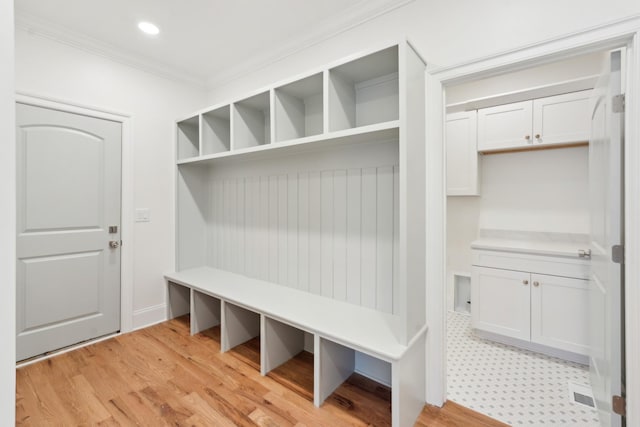 mudroom featuring recessed lighting, ornamental molding, and light wood-type flooring
