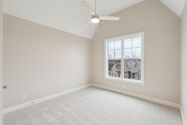 unfurnished room with baseboards, carpet flooring, ceiling fan, and vaulted ceiling