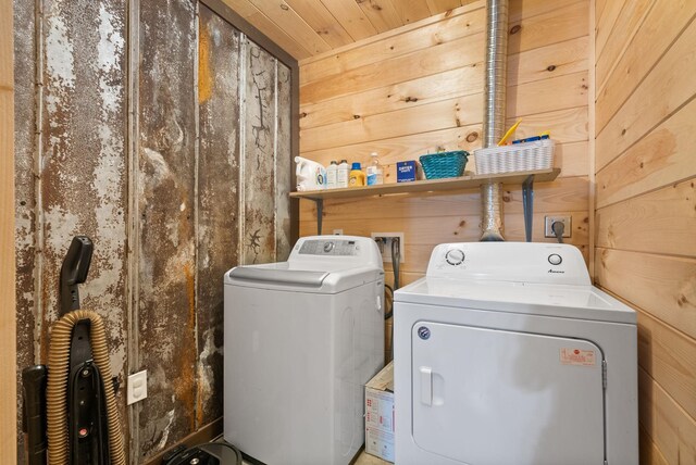 4231 Lylewood Rd, Indian Mound, TN 37079 - clothes washing area with independent washer and dryer, wooden walls, and laundry area