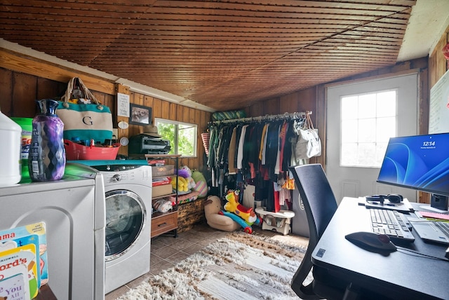 4231 Lylewood Rd, Indian Mound, TN 37079 - laundry area featuring independent washer and dryer, laundry area, wood walls, and tile patterned flooring
