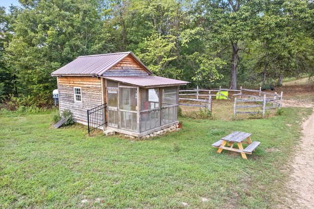 4231 Lylewood Rd, Indian Mound, TN 37079 - view of outbuilding featuring a sunroom and fence