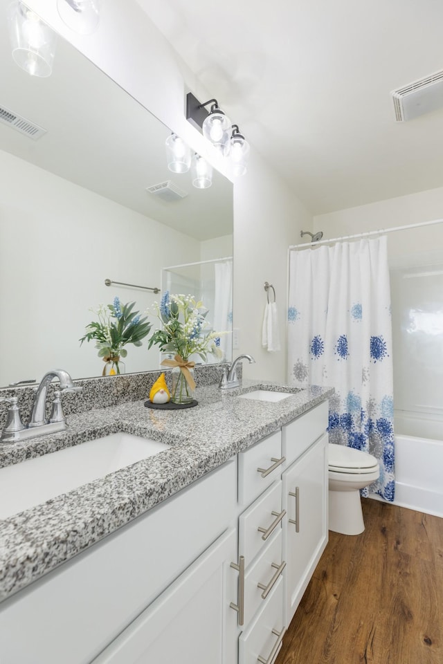 301 Harper Lndg Unit 301, Chapel Hill, TN 37034 - bathroom with double vanity, wood finished floors, and shower / tub combo with curtain