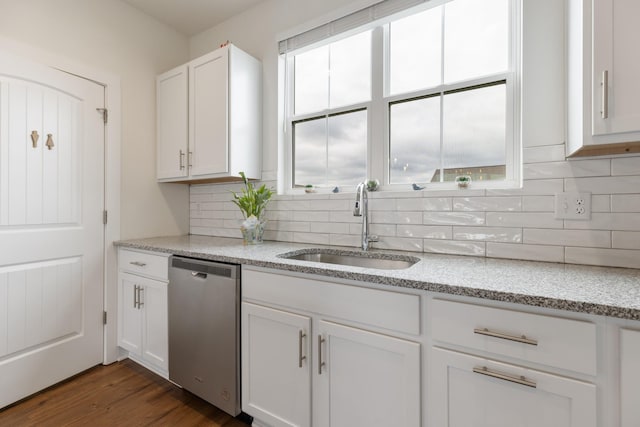 301 Harper Lndg Unit 301, Chapel Hill, TN 37034 - kitchen featuring stainless steel dishwasher, white cabinetry, backsplash, and light stone counters