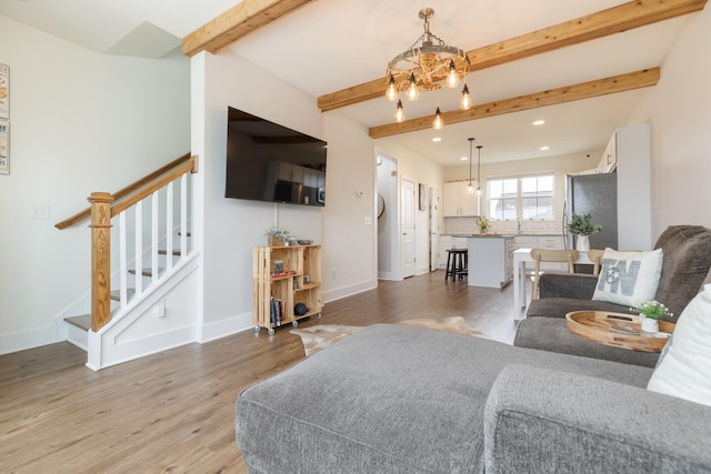 301 Harper Lndg Unit 301, Chapel Hill, TN 37034 - living room with a chandelier, light wood-style flooring, beam ceiling, stairs, and recessed lighting