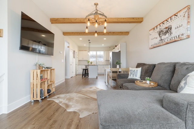 301 Harper Lndg Unit 301, Chapel Hill, TN 37034 - living area with light wood finished floors, recessed lighting, a chandelier, and beamed ceiling