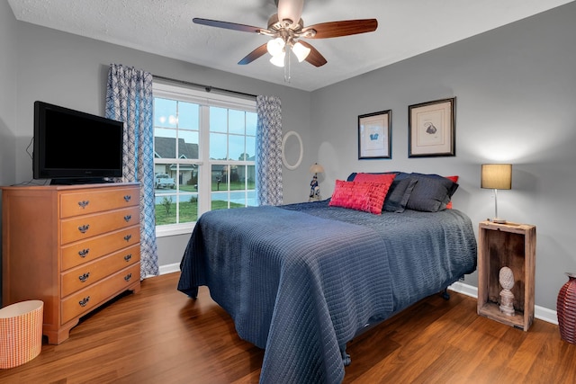 165 Daffodil Dr, Tullahoma, TN 37388 - bedroom featuring baseboards, wood finished floors, and a ceiling fan