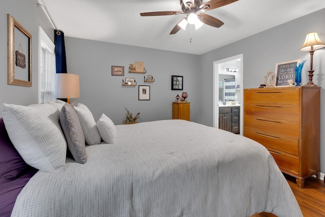 165 Daffodil Dr, Tullahoma, TN 37388 - bedroom with wood finished floors, ensuite bath, and ceiling fan