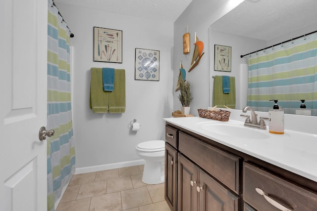 165 Daffodil Dr, Tullahoma, TN 37388 - bathroom with a textured ceiling, toilet, tile patterned flooring, vanity, and baseboards