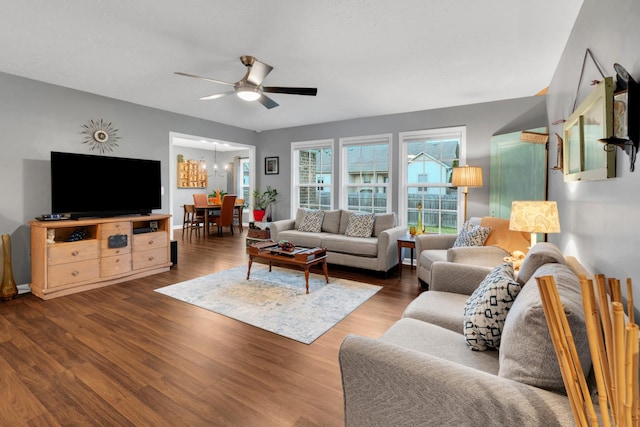 165 Daffodil Dr, Tullahoma, TN 37388 - living room featuring ceiling fan, wood finished floors, a chandelier, and baseboards