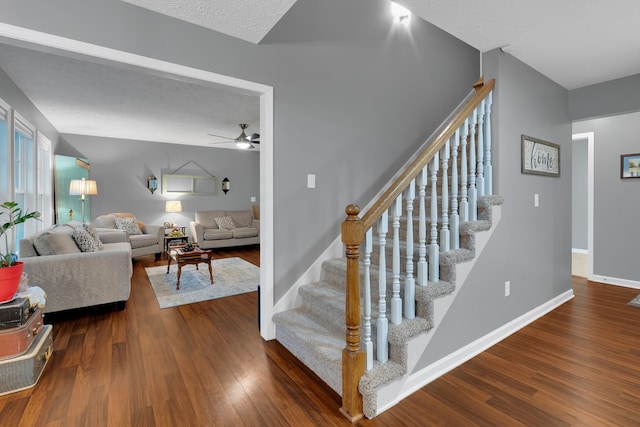 165 Daffodil Dr, Tullahoma, TN 37388 - stairs featuring a ceiling fan, wood finished floors, and baseboards