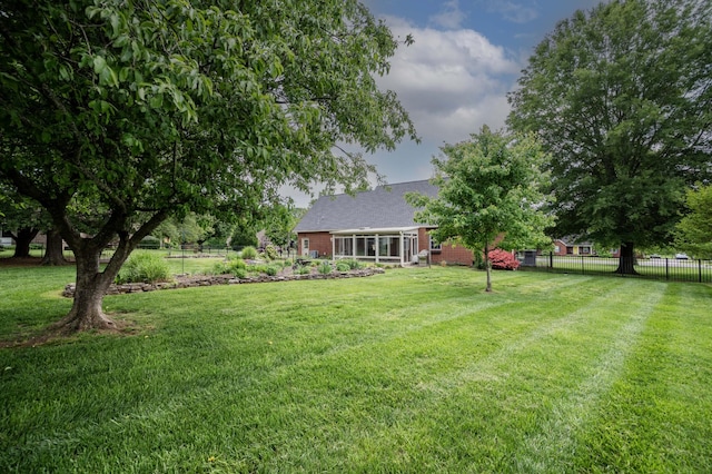 view of yard featuring fence