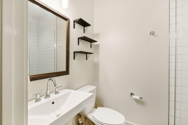 bathroom featuring a sink and toilet