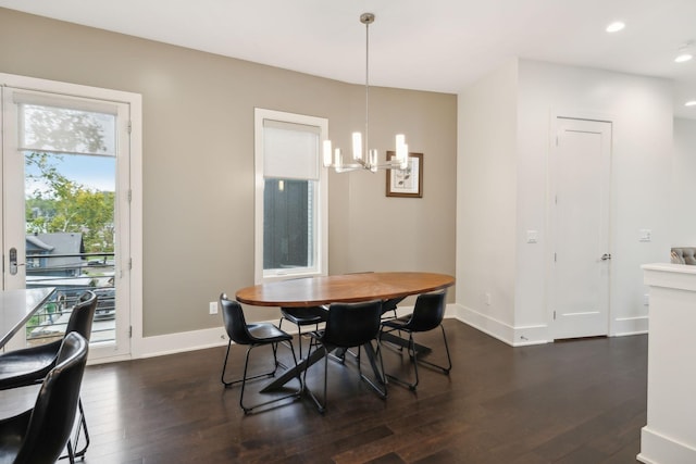 dining area with recessed lighting, dark wood-style flooring, baseboards, and an inviting chandelier