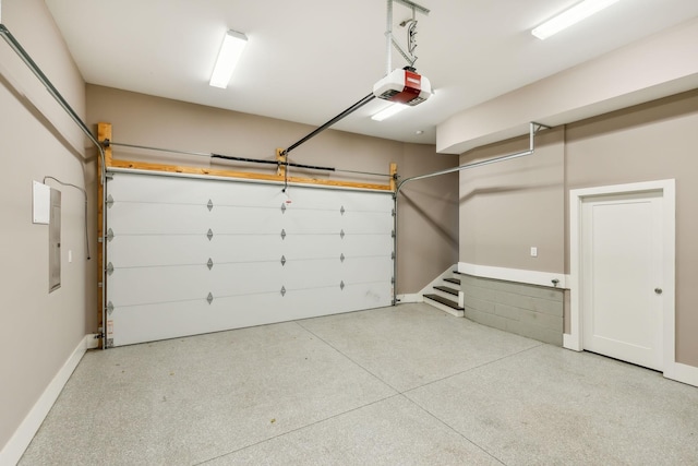 garage featuring baseboards and a garage door opener